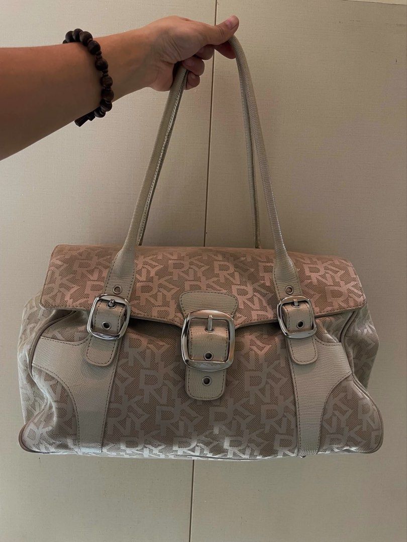 DKNY Monogram Canvas Shoulder Bag (Category: Luxury Bags & Wallets) located in Manila. Submitted by thevintagebow (Listing ID 1460184588, Image 1). Description: Elevate your everyday style with a heavy dose of Y2K nostalgia! 🍋‍🟩 This authentic DKNY monogram canvas shoulder bag features striking silver hardware, functional double buckles, and a gorgeous pop of lime-green lining inside. 🍃 Grab this iconic piece for just ₱3,000 PHP (valued at ₱5,
