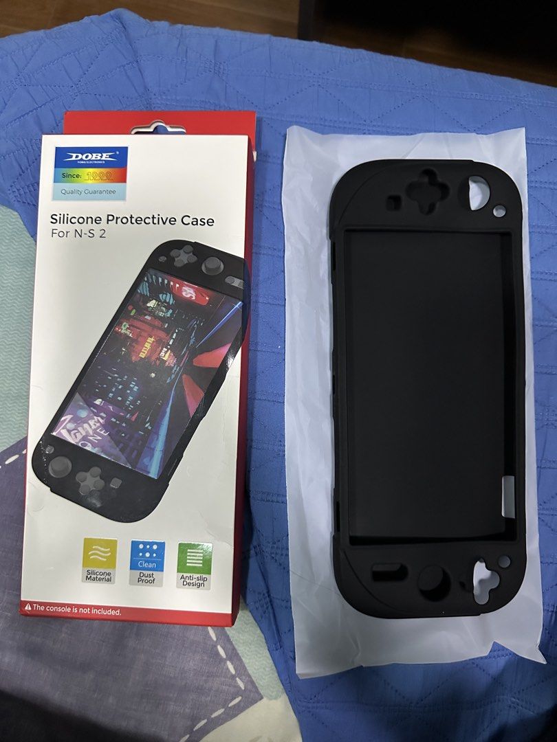 DOBE Silicone Protective Case for Nintendo Switch Lite (N-S 2) (Category: Nintendo) located in Quezon City. Submitted by tobygabriel.696 (Listing ID 1460216598, Image 1). Description: - Black silicone protective case for Nintendo Switch 2 - Made from durable silicone material - Features dustproof and anti-slip design - Offers protection against scratches and accidental drops - Please note: Console is not included.