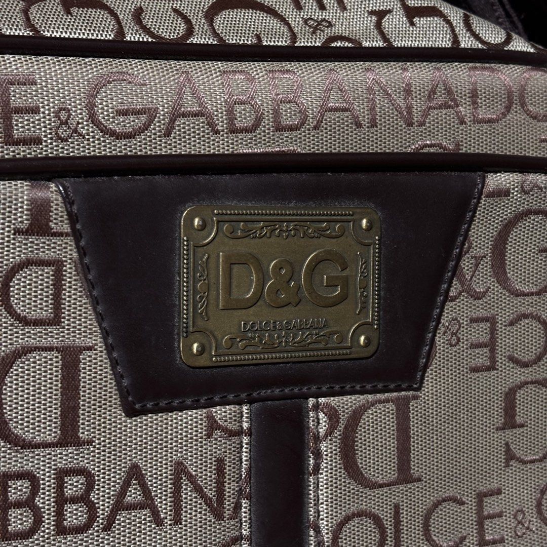 Dolce & Gabbana D&G Monogram Shoulder Bag (Category: Luxury Bags & Wallets) located in Caloocan City. Submitted by bonsatocha43876 (Listing ID 1460193567, Image 2). Description: - Authentic D&G shoulder bag - Classic all-over monogram print - Color: Brown and beige - Secure zipper closure - Spacious interior - Dimensions: 13 inches (width) x 10 inches (length) - Perfect for everyday use - Price: 850 pesos.