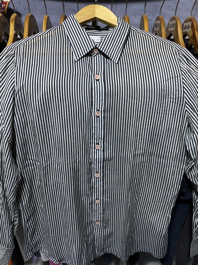 Dolce & Gabbana Striped Button-Up Shirt L (Category: Luxury Apparel) located in Santa Ana. Submitted by tunes_vtg (Listing ID 1460213700, Image 2). Description: - Dolce & Gabbana button-up shirt - Classic black and white vertical stripe pattern - Features D&G logo on the buttons - Size: Large (L) - Perfect for both casual and formal styling - Excellent condition - No issues - Dimes:L28.5xW19.5 ₱500+Sf.