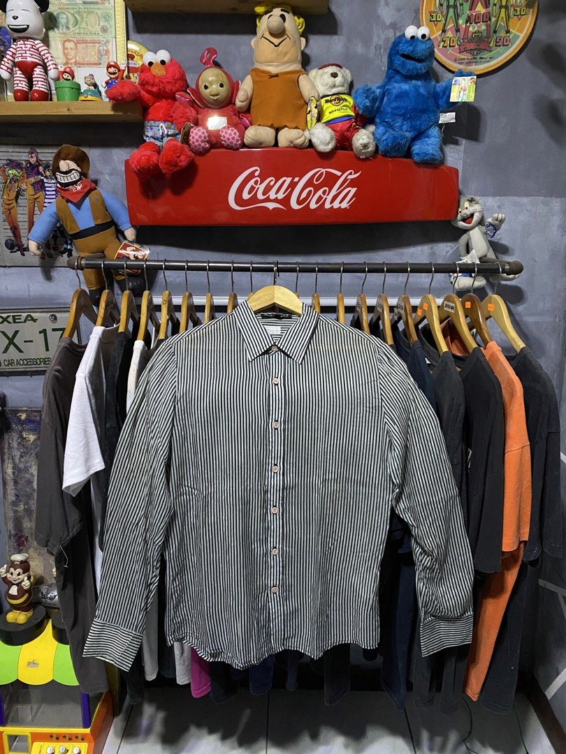 Dolce & Gabbana Striped Button-Up Shirt L (Category: Luxury Apparel) located in Santa Ana. Submitted by tunes_vtg (Listing ID 1460213700, Image 1). Description: - Dolce & Gabbana button-up shirt - Classic black and white vertical stripe pattern - Features D&G logo on the buttons - Size: Large (L) - Perfect for both casual and formal styling - Excellent condition - No issues - Dimes:L28.5xW19.5 ₱500+Sf.