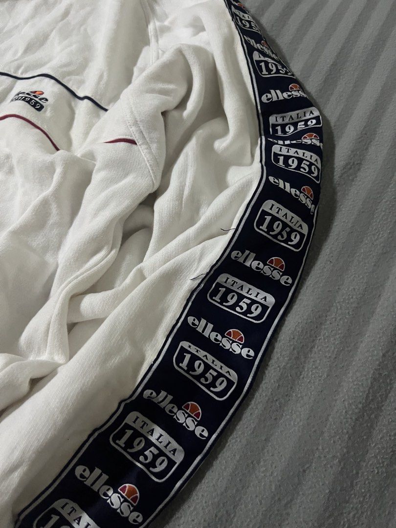 ELLESSE CREWNECK SIDETAPE LOGO (Category: Tshirts & Polo Shirts ) located in Manila. Submitted by yerrr. (Listing ID 1460277350, Image 3). Description: ELLESSE CREWNECK SIDETAPE LOGO PSG OUT🙌🏻 Size: Large on tag Dimes: 25 x 28.5 Excellent Condition Issue: 1 pinhole DM ME📥 NEGOTIABLE ₱1,800.