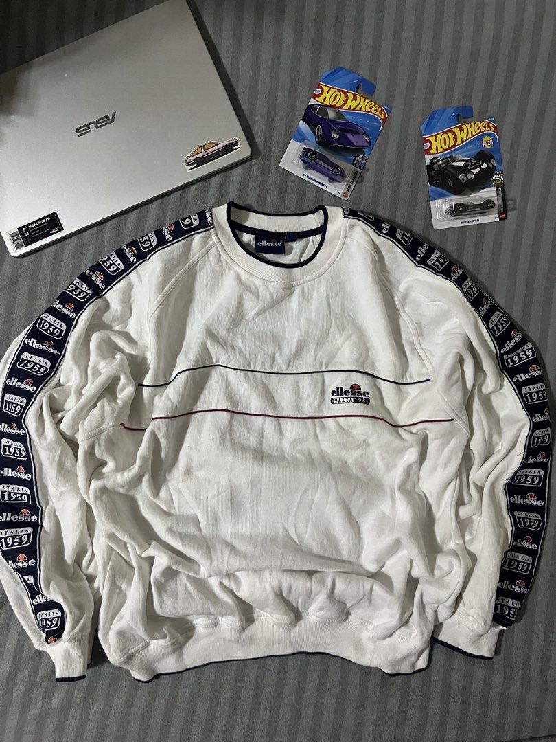 ELLESSE CREWNECK SIDETAPE LOGO (Category: Tshirts & Polo Shirts ) located in Manila. Submitted by yerrr. (Listing ID 1460277350, Image 1). Description: ELLESSE CREWNECK SIDETAPE LOGO PSG OUT🙌🏻 Size: Large on tag Dimes: 25 x 28.5 Excellent Condition Issue: 1 pinhole DM ME📥 NEGOTIABLE ₱1,800.