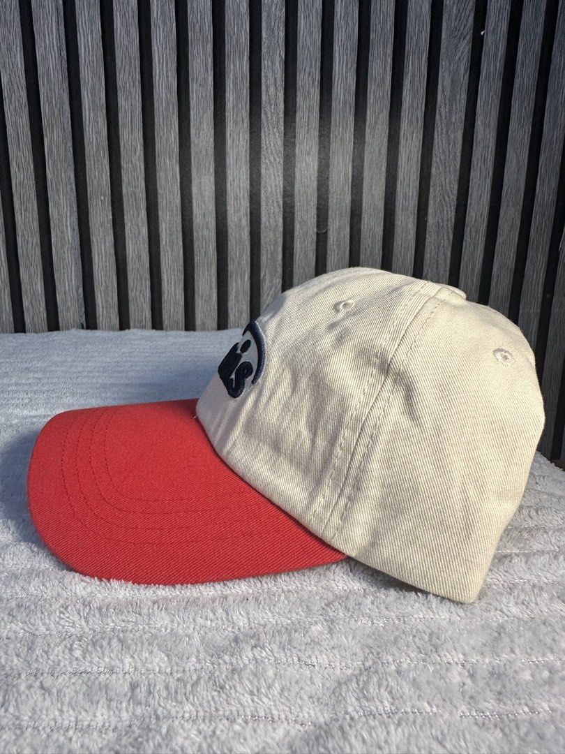 Emis Baseball Cap - Cream and Red (Category: Caps & Hats) located in Manila. Submitted by aoparaiso (Listing ID 1460260867, Image 2). Description: - Cream colored baseball cap - Red brim - 'emis' logo embroidered on front - Classic dad hat style - Adjustable strap at the back - Perfect for casual wear.