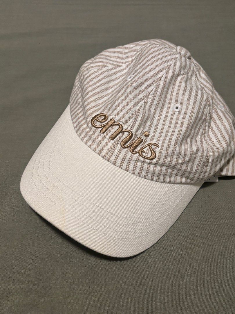 Emis Striped Baseball Cap (Category: Caps & Hats) located in Quezon City. Submitted by lbpapparel (Listing ID 1460156359, Image 1). Description: - Classic striped baseball cap - Features 'emis' embroidery - Solid off-white brim - Simple and versatile design - Ideal for casual wear and matching various outfits.
