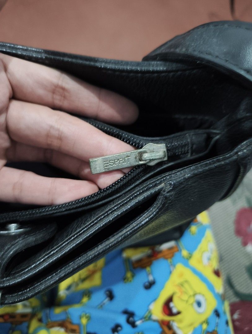 Esprit Black Leather Shoulder Bag (Category: Shoulder Bags) located in Manila. Submitted by marjdv29 (Listing ID 1460204844, Image 3). Description: - Esprit black shoulder bag - Textured leather material - Main compartment with zip closure - Exterior pocket for quick access - Silver hardware details on front and zipper pull - Adjustable strap for comfortable wear - Simple and classic design.