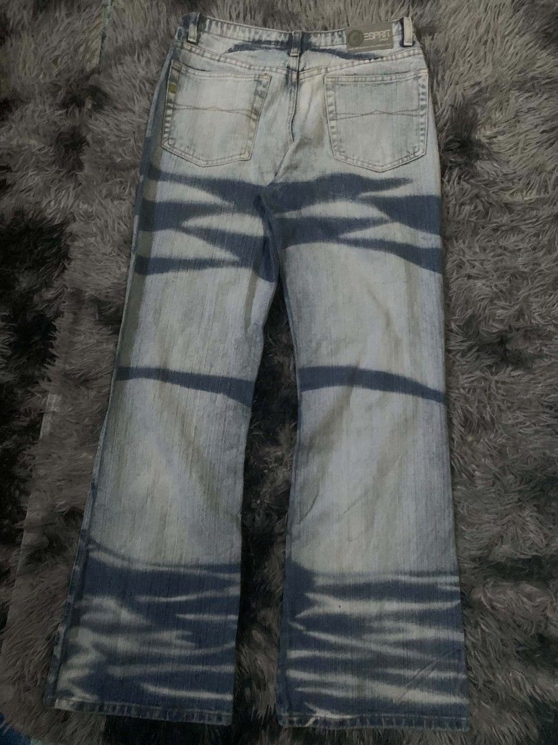 Esprit Jeans - Light Wash Flare Jeans with Unique Pattern (Category: Jeans) located in Tarlac. Submitted by rhandell_collectives (Listing ID 1460267923, Image 2). Description: - Brand: Esprit - Style: Flare leg jeans - Wash: Light wash denim - Design: Unique tie-dye or bleached pattern - Vibe: Statement piece, edgy, unique - Perfect for: Adding an edge to any outfit.