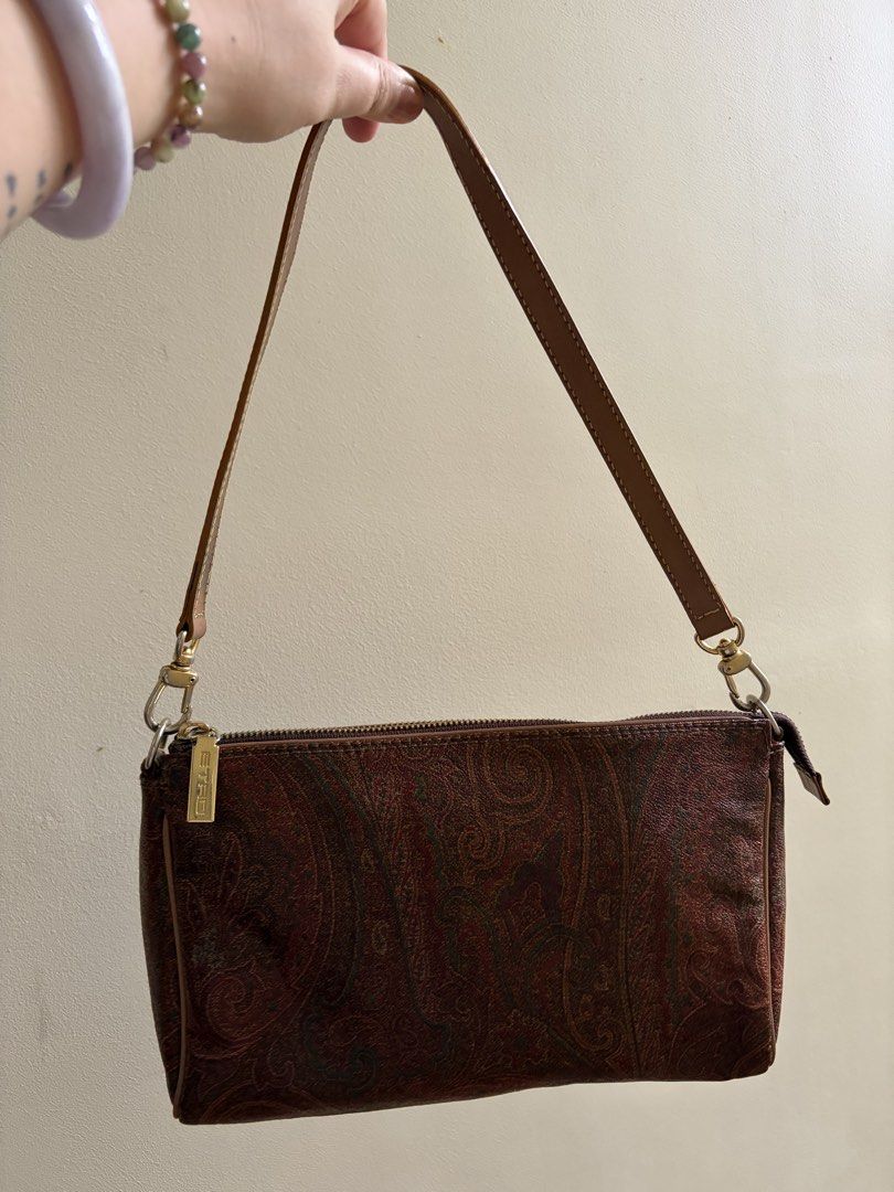 ETRO Paisley Shoulder Bag (Category: Shoulder Bags) located in Las Pinas. Submitted by heykc (Listing ID 1460132545, Image 1). Description: Flaws can be seen in the photos FREE SHIPPING - Classic Etro shoulder bag - Iconic brown paisley print - Genuine leather strap and trim - Secure zipper closure - Small metal logo tag on the front - Versatile for everyday or evening wear.