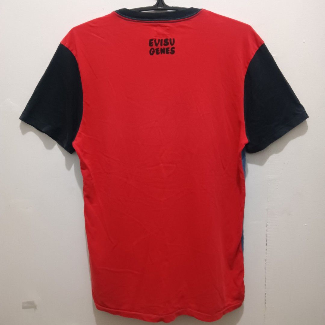 EVISU GENES Shirt (Blue/Orange) (Category: Tshirts & Polo Shirts ) located in Quezon City. Submitted by jaychingsss (Listing ID 1460204729, Image 2). Description: Evisu Genes Shirt - 100 18x27 Complete Tags Color Rate: 9/10 NEED WASH.