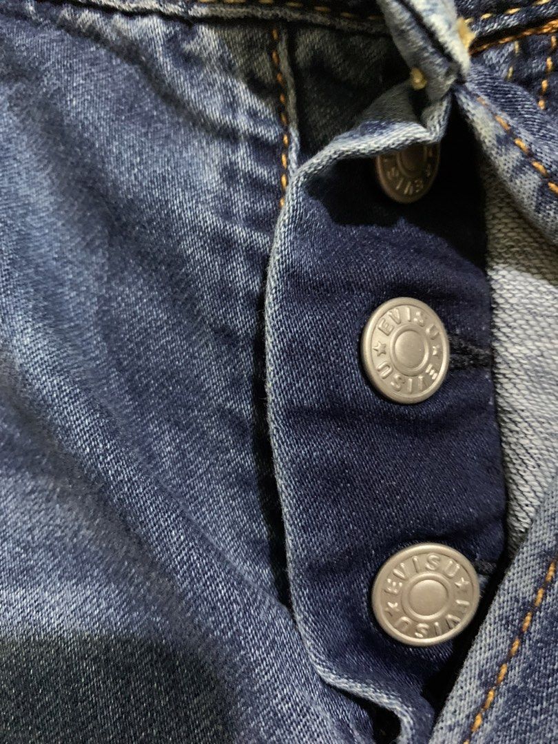 EVISU Jeans Blue Denim Button Fly with Logo Print (Category: Jeans) located in Marawi City. Submitted by biidnillah (Listing ID 1460155243, Image 3). Description: - Authentic Evisu Blue Denim Jeans - Size: 29+ size 32x34 -length :42 - Features iconic Evisu logo print down the legs - Classic button fly -lightweight denim stretch .