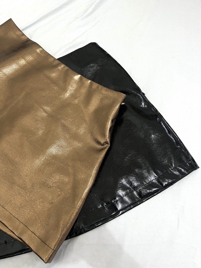 Faux Leather Mini Skirt - Black ✅ Gold ❌ (Category: Skirts) located in Makati City. Submitted by xxscg (Listing ID 1460190789, Image 2). Description: SHEIN faux leather mini skirts ✨ BRAND NEW!! 10/10 condition 🖤 Size S on tag (best fit for size 25-27) GOLD - SOLD ❌ BLACK - AVAILABLE ✅ - Both skirts feature a convenient side zipper closure. - Ideal for creating edgy looks for nights out, parties, or festivals. ₱250/each ‼️.