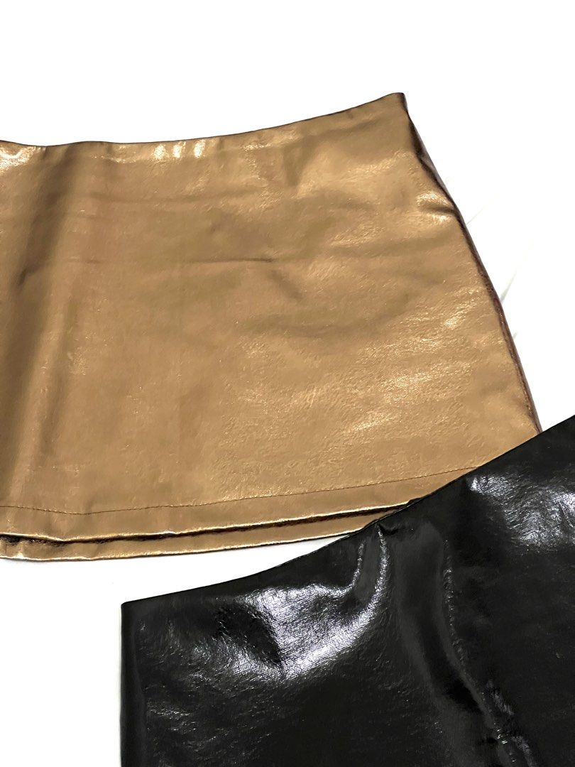 Faux Leather Mini Skirt - Black ✅ Gold ❌ (Category: Skirts) located in Makati City. Submitted by xxscg (Listing ID 1460190789, Image 3). Description: SHEIN faux leather mini skirts ✨ BRAND NEW!! 10/10 condition 🖤 Size S on tag (best fit for size 25-27) GOLD - SOLD ❌ BLACK - AVAILABLE ✅ - Both skirts feature a convenient side zipper closure. - Ideal for creating edgy looks for nights out, parties, or festivals. ₱250/each ‼️.