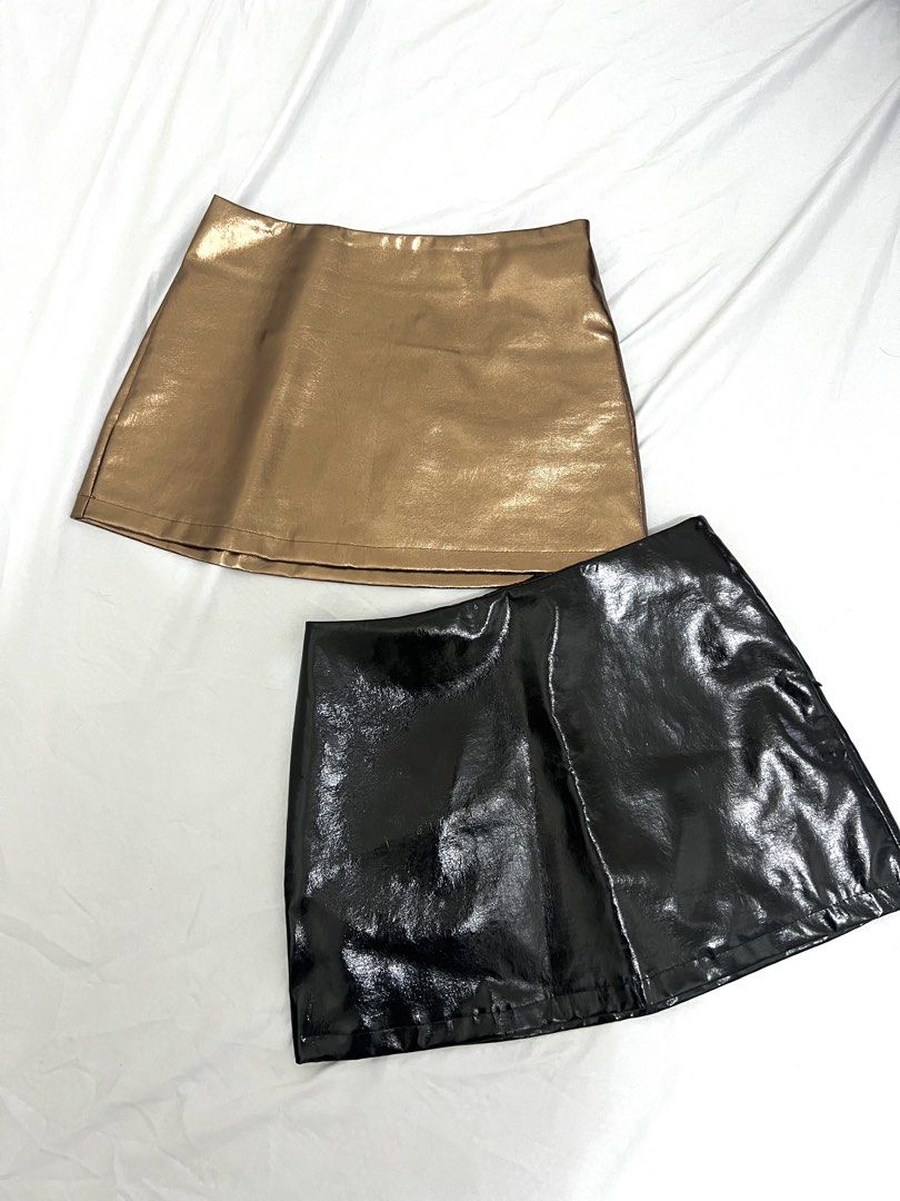 Faux Leather Mini Skirt - Black ✅ Gold ❌ (Category: Skirts) located in Makati City. Submitted by xxscg (Listing ID 1460190789, Image 1). Description: SHEIN faux leather mini skirts ✨ BRAND NEW!! 10/10 condition 🖤 Size S on tag (best fit for size 25-27) GOLD - SOLD ❌ BLACK - AVAILABLE ✅ - Both skirts feature a convenient side zipper closure. - Ideal for creating edgy looks for nights out, parties, or festivals. ₱250/each ‼️.