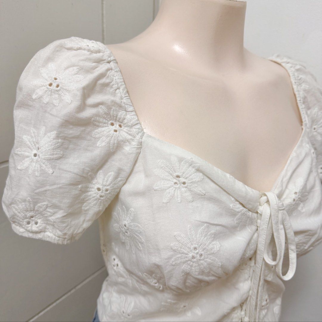 FB SISTER White Tie-Front Eyelet Top [S] (Category: Blouses) located in Malabon City. Submitted by k_intimates (Listing ID 1460293786, Image 3). Description: Details: • Size Small • No issues (no stains, but need to wash since nastore sa clothing rack) • White, short-sleeve crop top with a sweetheart neckline, and a drawstring front tie detail featuring delicate floral eyelet embroidery..
