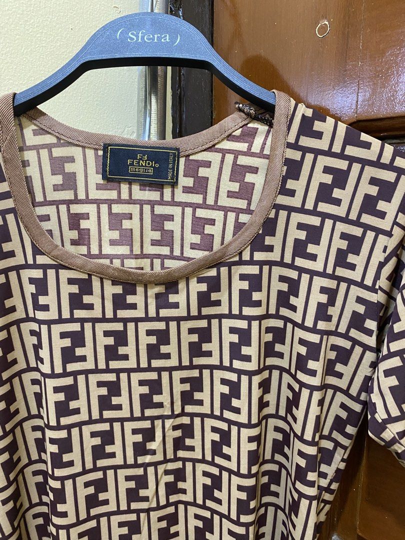 Fendi FF Monogram T-Shirt (Category: Luxury Apparel) located in Manila. Submitted by haveago0dthrift (Listing ID 1460151442, Image 3). Description: - Authentic Fendi FF monogram t-shirt - Classic brown and beige colorway - Short sleeves and round neckline - Made in Italy - Size XS - Ideal for everyday casual wear -Width 21 - Length 22.