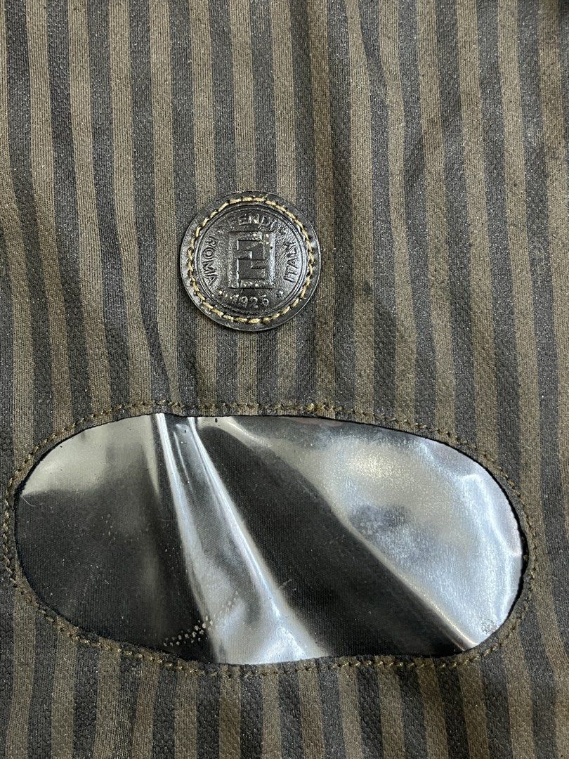 Fendi Roma Italy Garment Bag (Category: Luxury Bags & Wallets) located in Mabalacat. Submitted by aas_thriftfings (Listing ID 1460185876, Image 2). Description: - Authentic Fendi garment bag - Classic Fendi monogram pattern - Clear window to view contents - Zipper closure with Fendi branded pull - Ideal for storing/transporting suits, dresses, and formal wear - Protects your garments.