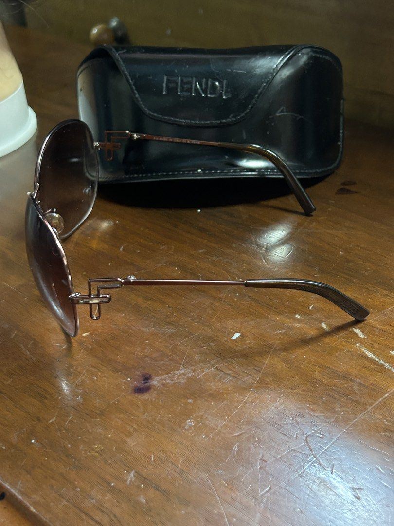 Fendi Round Rose Gold Sunglasses (Category: Sunglasses & Eyewear) located in Caloocan City. Submitted by guitara1822 (Listing ID 1460147274, Image 2). Description: - Round sunglasses with a chic rose gold frame. - Features tinted lenses for a stylish look. - Subtle sheen on the frame adds a touch of elegance. - An essential accessory for sunny days and daily outfits..