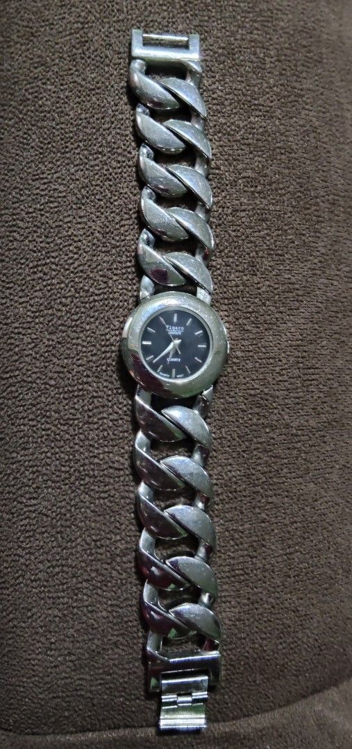 Figaro Paris Quartz Stainless Steel Watch (Category: Women's Watches) located in Quirino. Submitted by megay12 (Listing ID 1460213313, Image 3). Description: - Figaro Paris watch - Black face - Stainless steel band with unique link design - Quartz movement - Model number 4763 on back - Silver-tone metal - Perfect accessory for everyday wear - Works well.