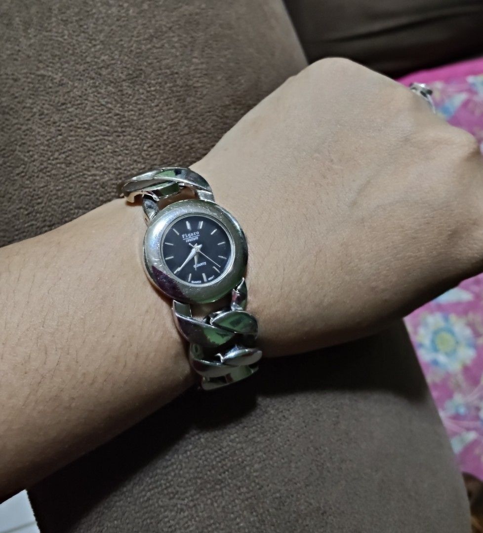 Figaro Paris Quartz Stainless Steel Watch (Category: Women's Watches) located in Quirino. Submitted by megay12 (Listing ID 1460213313, Image 1). Description: - Figaro Paris watch - Black face - Stainless steel band with unique link design - Quartz movement - Model number 4763 on back - Silver-tone metal - Perfect accessory for everyday wear - Works well.