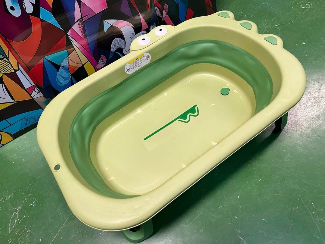 Foldable Baby Bathtub with Cute Crocodile Design (Category: Bathtub & Bath Accessories) located in Antipolo. Submitted by istitikfordago (Listing ID 1460221233, Image 1). Description: - Lightweight and foldable for easy storage and travel - Adorable crocodile design with fun eyes and toes - Built-in drain plug for quick and easy emptying - Perfect for bath time at home or on the go - Made from safe and durable materials.