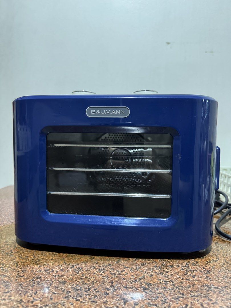 Food Dehydrator Baumann (Category: Fryers) located in Manila. Submitted by rnc.shop (Listing ID 1460239362, Image 1). Description: Manila pickup location Good condition, like new Features: Extends your food’s shelf life Adjustable timer, temperature control, and 4-drawer mesh drying trays Net Weight: 3 KGs Product Dimensions: 13.5 x 13 x 10 IN .