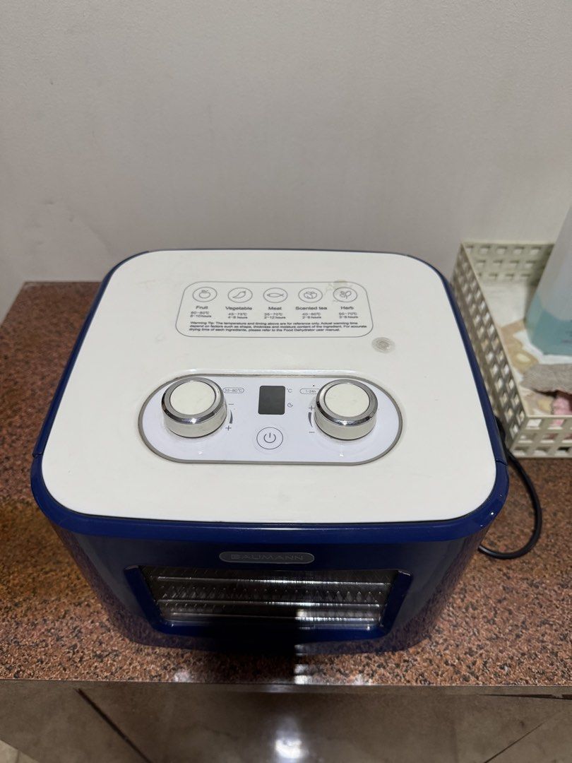 Food Dehydrator Baumann (Category: Fryers) located in Manila. Submitted by rnc.shop (Listing ID 1460239362, Image 2). Description: Manila pickup location Good condition, like new Features: Extends your food’s shelf life Adjustable timer, temperature control, and 4-drawer mesh drying trays Net Weight: 3 KGs Product Dimensions: 13.5 x 13 x 10 IN .