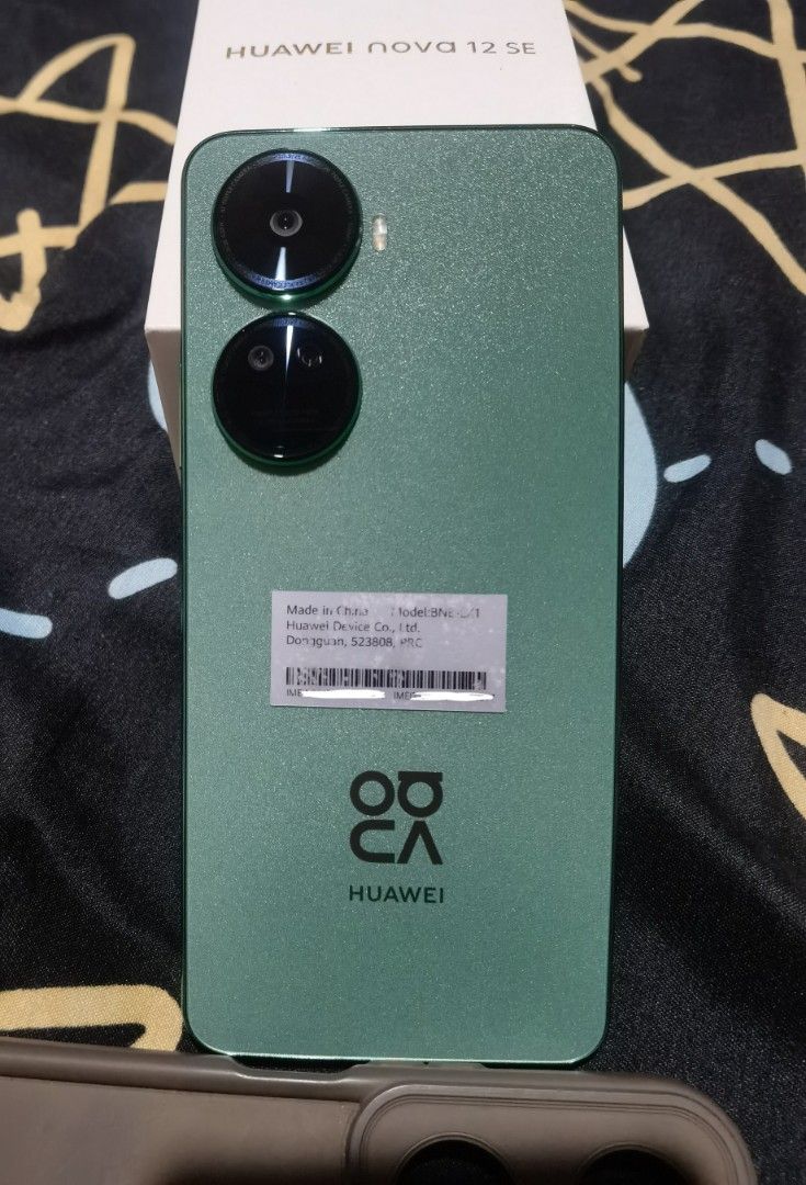 For Sale Huawei Nova 12 SE (Category: Huawei) located in Quezon City. Submitted by champshop (Listing ID 1460241691, Image 3). Description: 📌 For Sale Huawei Nova 12 SE 📌 - 8/256gb Variant - No Issues/Dents (see pictures) - with original box and 3 free cases - Sim 1 Globe Locked/ Sim 2 Openline - with native Google Mobile Services (MicroG & Aurora App Store) - meet up Commonwealth ave, SM North/Trinoma For only 9,000 pesos (slightly negotiable)
