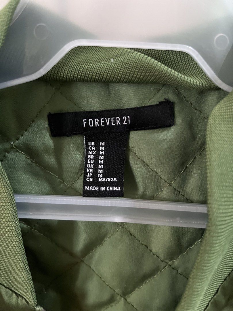 Forever 21 Green Bomber Jacket with Eagle Embroidery (Category: Coats, Jackets and Outerwear) located in Quezon City. Submitted by jreesey (Listing ID 1460127719, Image 2). Description: Forever 21 Green Bomber Jacket - Design has red, black, and white embroidered birds/eagles - Back includes statement graphic, says“Join a Girl Gang” - 2016-2018 vibes - Shiny olive green or army green color - Cropped style RFS: Decluttering Payment Method Options: