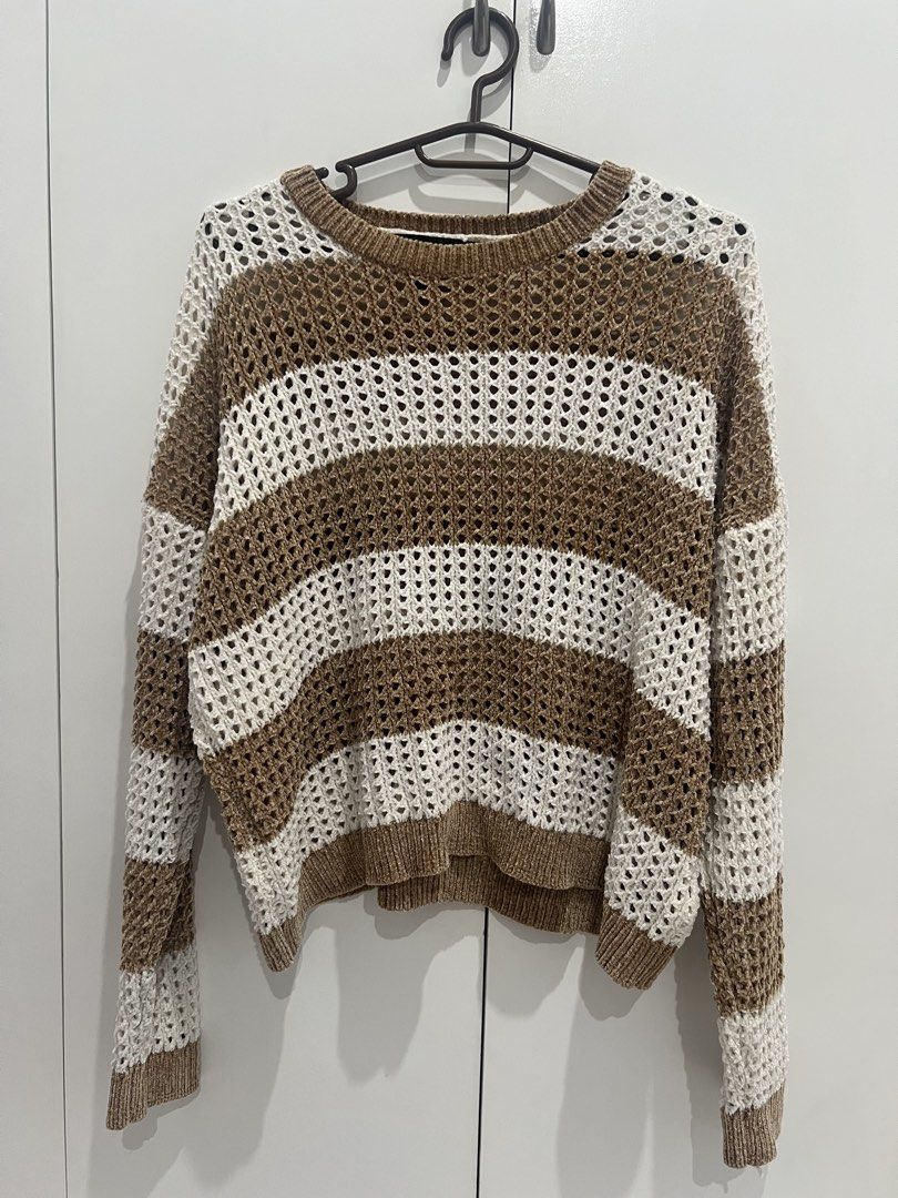 Forever 21 Striped Crochet Knit Sweater (Category: Coats, Jackets and Outerwear) located in Cainta. Submitted by cendzz (Listing ID 1460292191, Image 2). Description: - Brand: Forever 21 - Style: Crochet knit sweater - Color: Brown and white stripes - Neckline: Crew neck - Sleeves: Long sleeves - Knit Pattern: Loose knit - Features: Super comfy and stylish, great for layering or wearing alone.