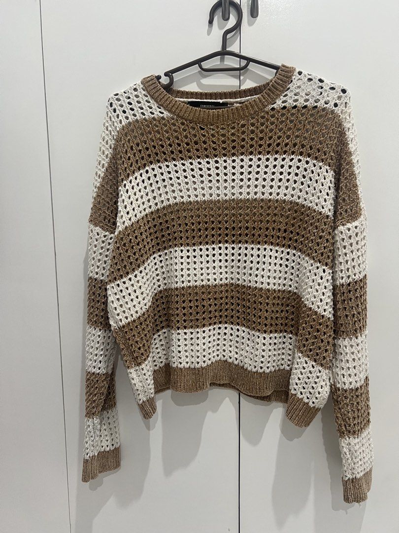Forever 21 Striped Crochet Knit Sweater (Category: Coats, Jackets and Outerwear) located in Cainta. Submitted by cendzz (Listing ID 1460292191, Image 1). Description: - Brand: Forever 21 - Style: Crochet knit sweater - Color: Brown and white stripes - Neckline: Crew neck - Sleeves: Long sleeves - Knit Pattern: Loose knit - Features: Super comfy and stylish, great for layering or wearing alone.
