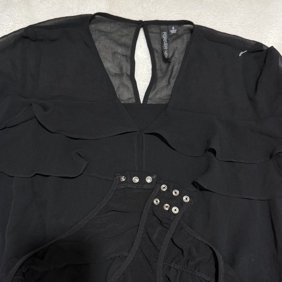 Forever New Black Ruffled Bodysuit | S (Category: Others Tops) located in Manila. Submitted by meisu_mnl (Listing ID 1460236377, Image 2). Description: Forever New Black Ruffled Bodysuit 🖤✨ Like new ✨ Size: S Color: Black Bust: up to 38" Waist: 28–36" • Sheer mesh neckline & sleeves • Layered ruffle detail • V-neck • Elegant & feminine • Snap-button closure Chic, classy, and perfect for a night-out look. 🖤✨ #ForeverNew #ForeverNewPH #BlackBodys