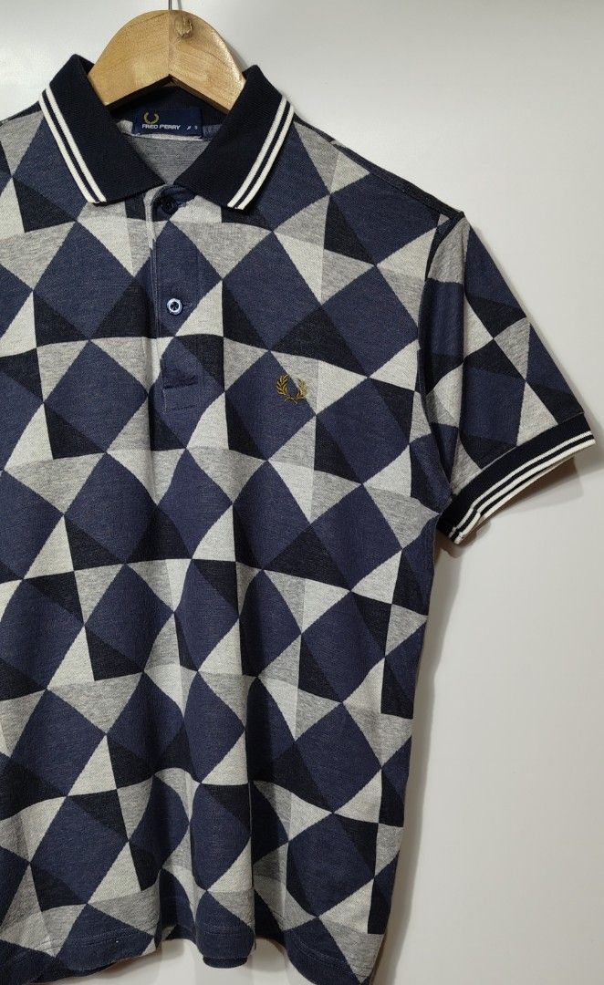 Fred Perry Geometric Pattern Twin Tipped Polo (Category: Tshirts & Polo Shirts ) located in Manila. Submitted by haute_addictionph (Listing ID 1460172475, Image 2). Description: Fred Perry Geometric Pattern Twin Tipped Polo Size: Small on tag Dimensions: 17.5 x 23 Condition: Excellent Issue: Unnoticeable collar folding mark Cloth: 9.5/10 Color: 9.5/10 Disclaimer: Despite every effort to provide accurate images of each item’s colour and design, ac