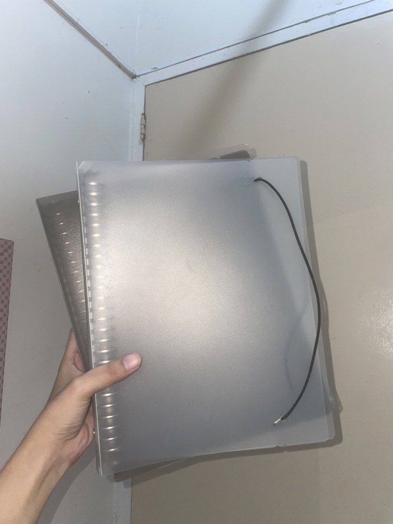 TAKE ALL! B5 Binder Folder with FREE REFILL (Category: Stationery & School Supplies) located in Manila. Submitted by jies.closet (Listing ID 1460250203, Image 1). Description: 150 SET! - Frosted binder folder - Elastic strap for secure closure - Ample space for papers - Ideal for organizing notes and projects - Two available - Sold separately.