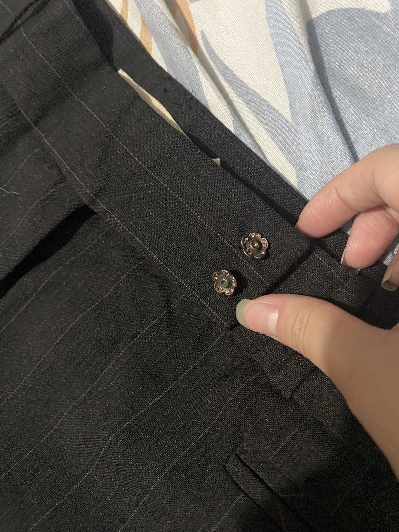G2000 Black Flare Pants (Category: Other Bottoms) located in Manila. Submitted by leijazminn (Listing ID 1460236847, Image 3). Description: - Black pants with subtle pinstripe detail - Flattering flare leg style - Two decorative buttons at the waist - Small fabric mark present (refer to last photo) - Ideal for office wear or a smart casual outfit.