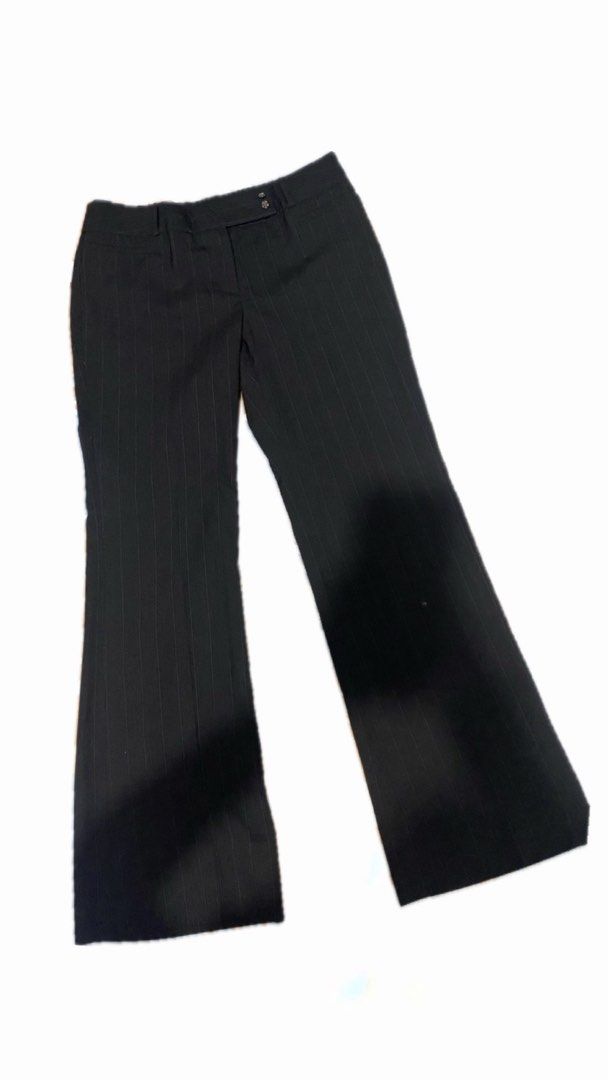 G2000 Black Flare Pants (Category: Other Bottoms) located in Manila. Submitted by leijazminn (Listing ID 1460236847, Image 1). Description: - Black pants with subtle pinstripe detail - Flattering flare leg style - Two decorative buttons at the waist - Small fabric mark present (refer to last photo) - Ideal for office wear or a smart casual outfit.