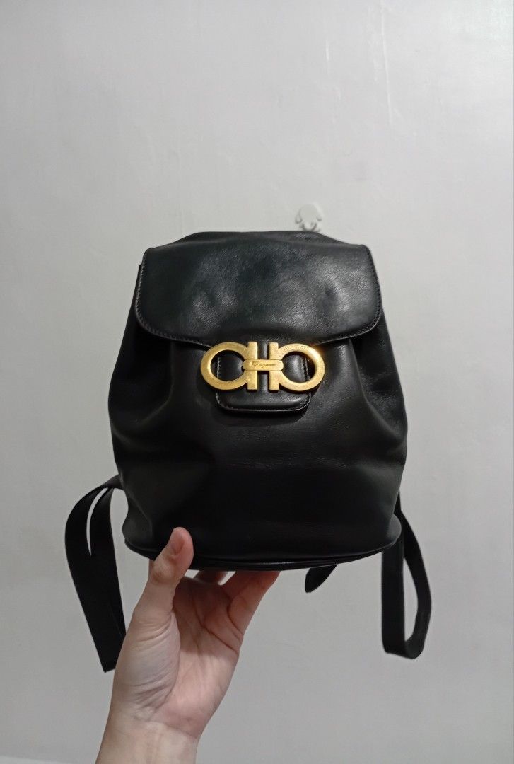 GANCINI Salvatore Ferragamo Mini BP (Category: Luxury Bags & Wallets) located in Navotas City. Submitted by riyuwi (Listing ID 1460168101, Image 2). Description: PREOWNED Lightly.Used WellUsed Authentic 💯 GANCINI Salvatore Ferragamo black Mini backpack leather Small Compact Sized Coded Classic black leather backpack - Salvatore Ferragamo brand - Iconic gold Gancini hardware - Drawstring closure with flap top - Adjustable leather straps - Timeles