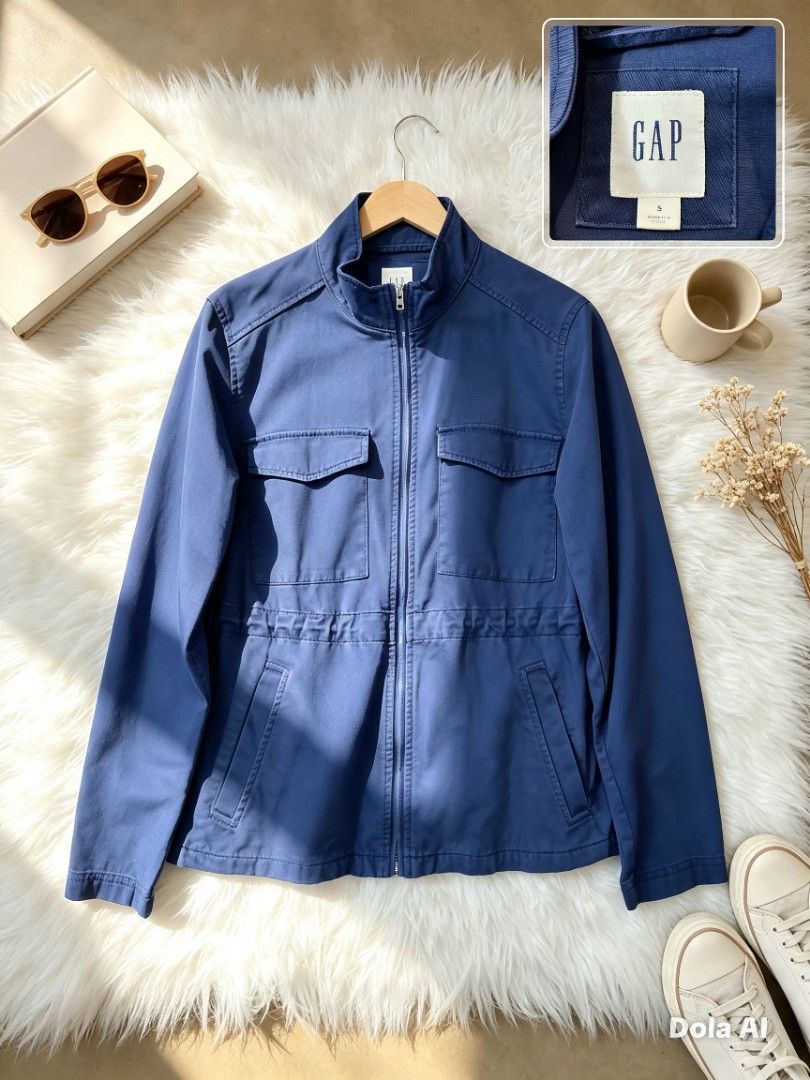 GAP Blue Utility Jacket Size S (Category: Coats, Jackets and Outerwear) located in Manila. Submitted by momofunodos (Listing ID 1460197680, Image 1). Description: - Cool blue utility jacket from GAP - Features a drawstring waist for adjustable fit - Two chest pockets and two side pockets for storage - Zip-up front with a snap button closure overlay - Ideal for layering and casual wear.