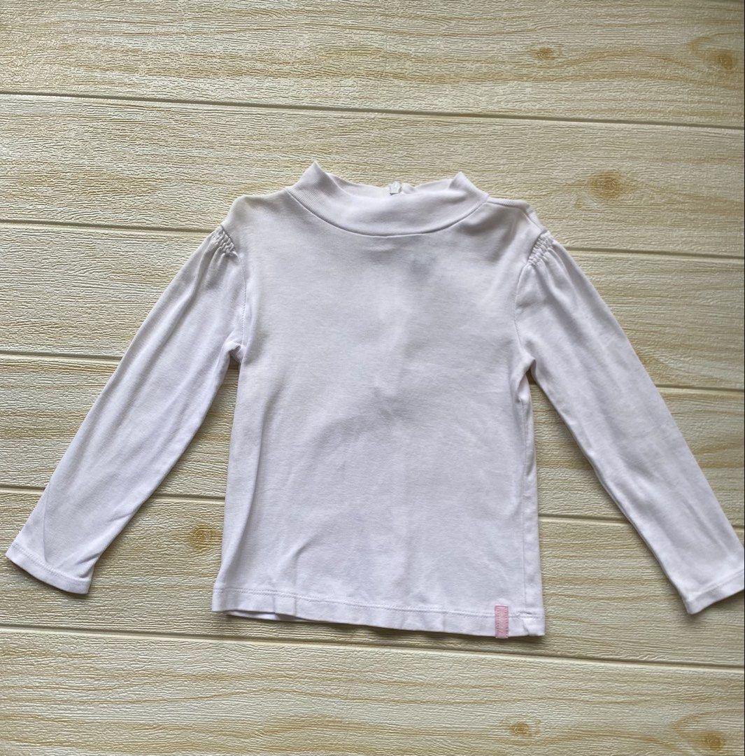 Gap white long-sleeve (Category: Babies & Kids Fashion) located in Cebu City. Submitted by yjainani (Listing ID 1460164193, Image 1). Description: mock-neck top with delicate gathered shoulder details.