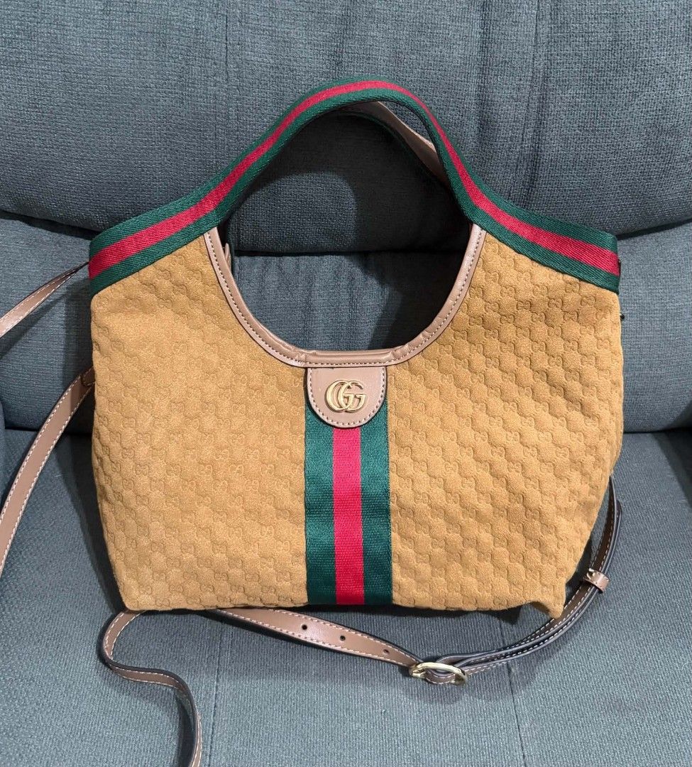 GG Suede Giglio Small Hobo (Category: Shoulder Bags) located in Quezon City. Submitted by luxxechic (Listing ID 1460133142, Image 2). Description: coded with black etiketa with pouch with sling with dust bag good as new no issue actual photo posted japan preloved mop: gcash .