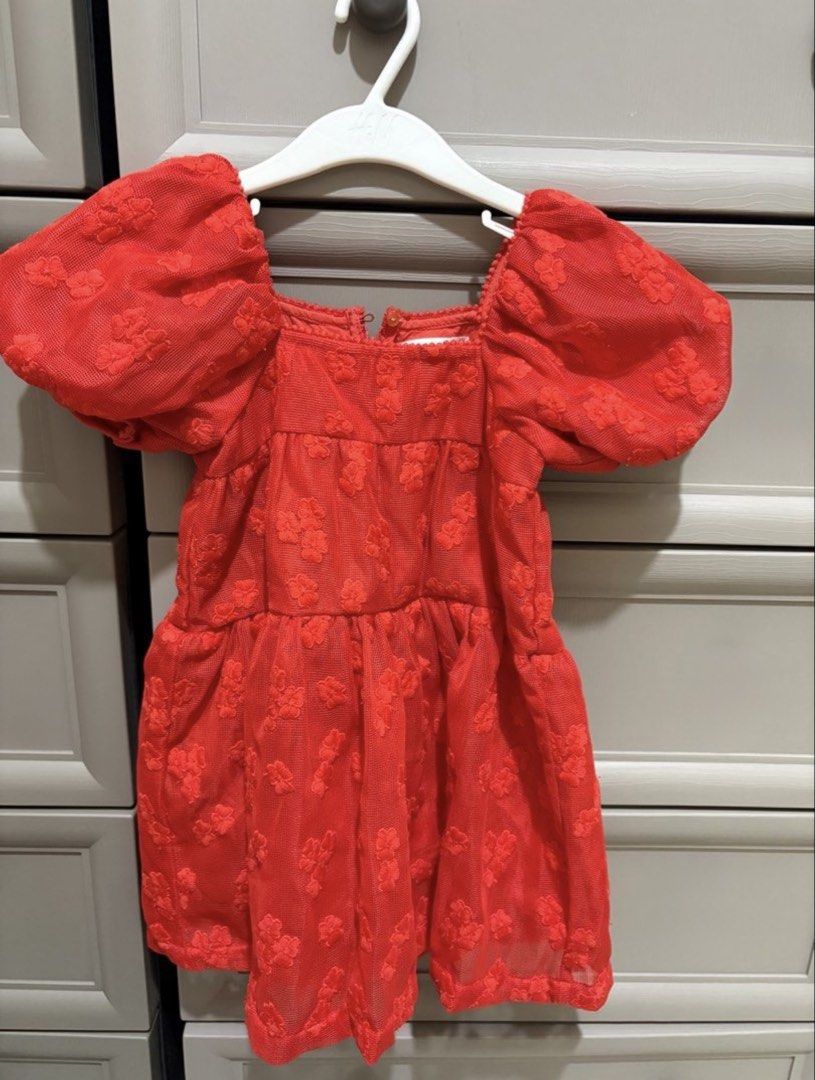 Gingersnaps Red Puff Sleeve Dress (Size 4) (Category: Babies & Kids Fashion) located in Sarrat. Submitted by relovedbyll (Listing ID 1460165981, Image 2). Description: - Adorable red dress from Gingersnaps. - Features charming puff sleeves. - Beautiful lace overlay with delicate floral details. - Made from light and airy fabric, ideal for comfort. - Perfect for parties and special occasions. - Convenient zipper closure at the back. - Decorative b