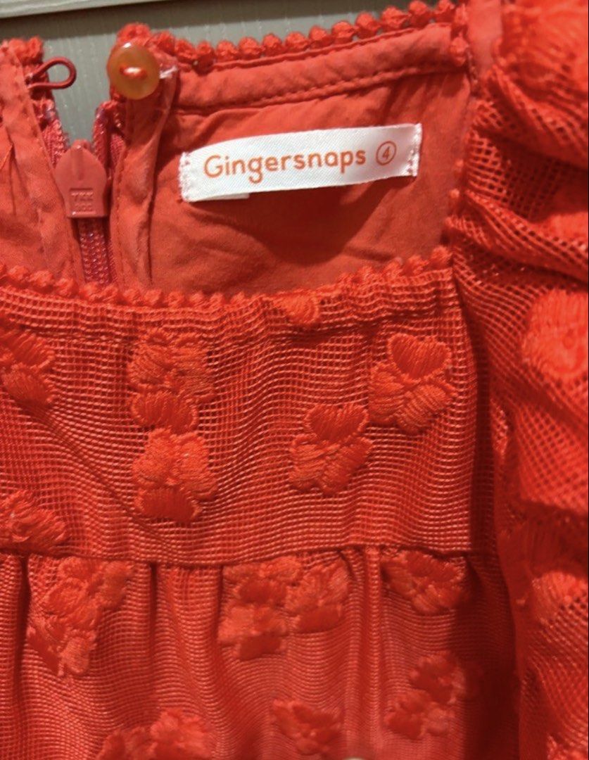 Gingersnaps Red Puff Sleeve Dress (Size 4) (Category: Babies & Kids Fashion) located in Sarrat. Submitted by relovedbyll (Listing ID 1460165981, Image 3). Description: - Adorable red dress from Gingersnaps. - Features charming puff sleeves. - Beautiful lace overlay with delicate floral details. - Made from light and airy fabric, ideal for comfort. - Perfect for parties and special occasions. - Convenient zipper closure at the back. - Decorative b