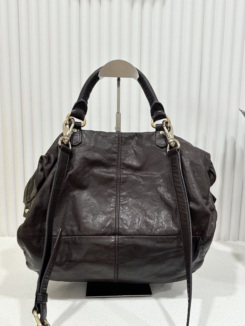 Givenchy leather 2 way bag Vintage for 12k birthday sale! (Category: Luxury Bags & Wallets) located in Quezon City. Submitted by nancdmd (Listing ID 1460251978, Image 2). Description: Vintage Givenchy 4G leather satchel for sale - distressed brown leather with gold HW - clasic 4G logo, top handle, detachable long strap, zip compartments - slouchy shape - L 13 in, H 12 in, D 4 in Authenticity guaranteed or your money back.