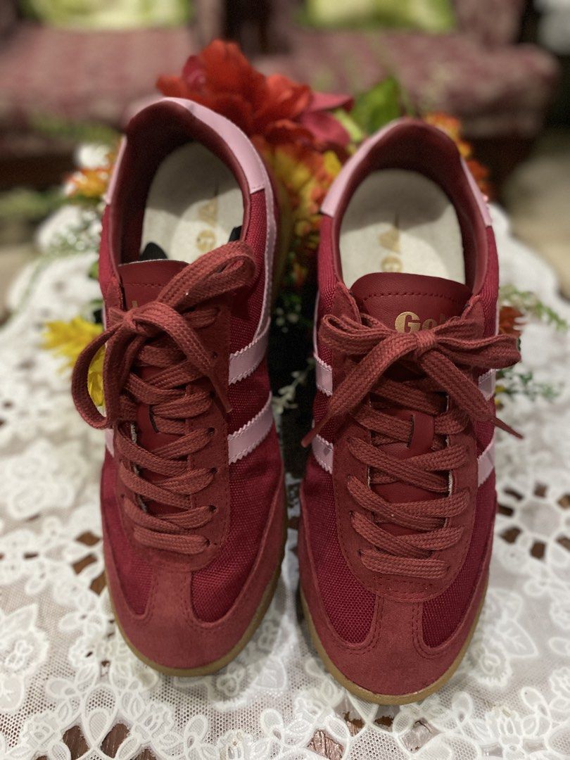 Gola Red Suede Sneakers (Category: Sneakers) located in Caloocan City. Submitted by curlyelephantshop (Listing ID 1460209348, Image 3). Description: - ISSUE: No box - Classic Gola sneakers in a deep red color. - Suede and fabric upper with subtle light pink accents. - Laces are intact and securely tied. - Ideal for everyday casual wear..