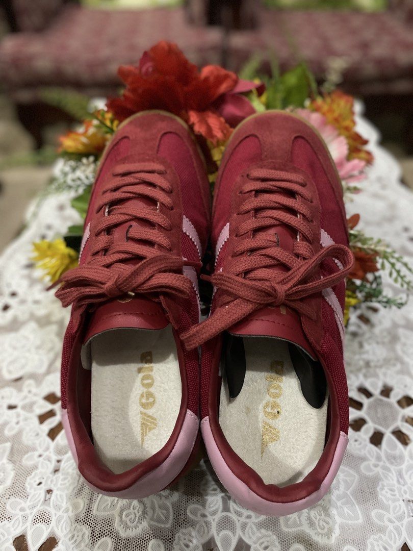 Gola Red Suede Sneakers (Category: Sneakers) located in Caloocan City. Submitted by curlyelephantshop (Listing ID 1460209348, Image 1). Description: - ISSUE: No box - Classic Gola sneakers in a deep red color. - Suede and fabric upper with subtle light pink accents. - Laces are intact and securely tied. - Ideal for everyday casual wear..