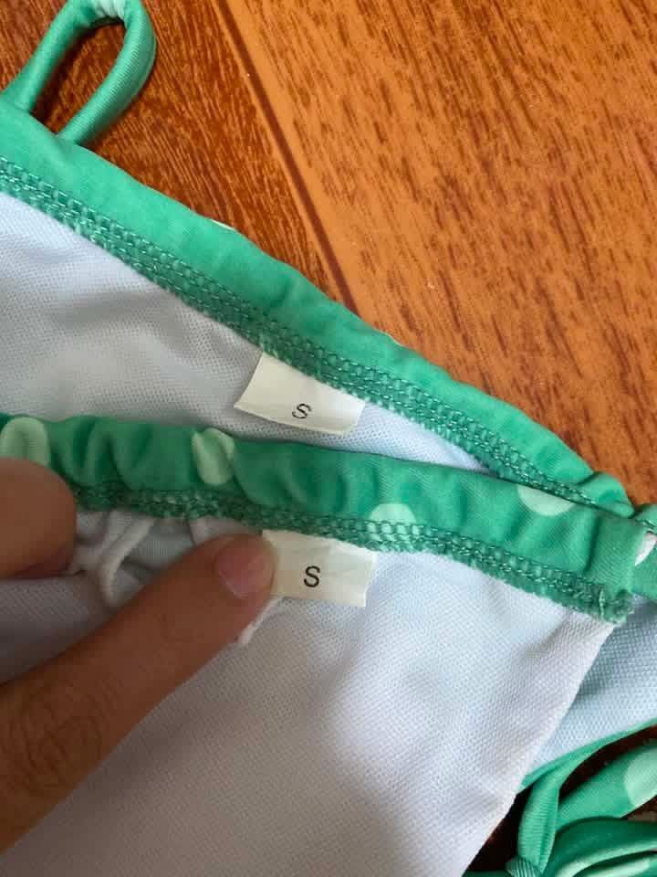 Green Polka Dot String Bikini Set Size S (Category: Bikinis & Swimsuits) located in Manila. Submitted by airamef28.closet (Listing ID 1460264194, Image 2). Description: - Adorable green bikini with white polka dots. - Triangle top with adjustable string ties. - Matching bottoms with adjustable side ties. - Size: S (both top and bottom). - Ideal for beach days or poolside lounging..