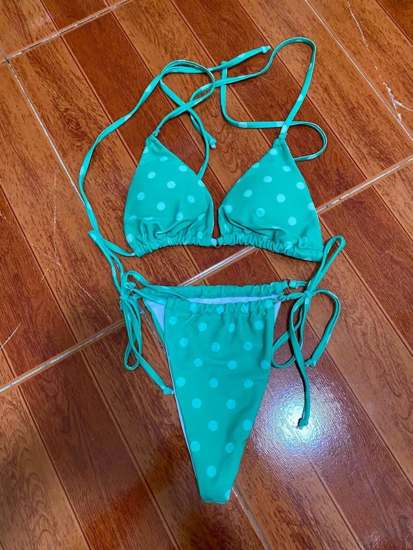 Green Polka Dot String Bikini Set Size S (Category: Bikinis & Swimsuits) located in Manila. Submitted by airamef28.closet (Listing ID 1460264194, Image 1). Description: - Adorable green bikini with white polka dots. - Triangle top with adjustable string ties. - Matching bottoms with adjustable side ties. - Size: S (both top and bottom). - Ideal for beach days or poolside lounging..