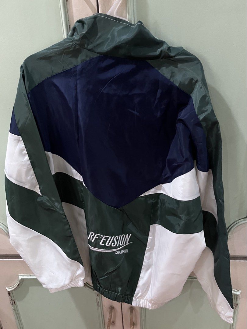 Green, White, and Blue Windbreaker Jacket (Category: Coats, Jackets and Outerwear) located in Quezon City. Submitted by jreesey (Listing ID 1460163750, Image 2). Description: 1980s Vibes Windbreaker Jacket - Dark Blue, White, and Dark Green Design - Fits any gender - RF’Eusion Champion (Tag says “ErLuoShiJia”) - No hood - Lightweight and breathable material and water resistant - Ideal for casual wear, sports activities, and light rainy drizzle we