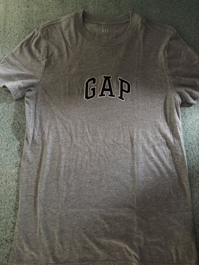Grey GAP T-Shirt (Category: Tshirts & Polo Shirts ) located in Bacoor. Submitted by jayps07 (Listing ID 1460159791, Image 1). Description: - Classic grey t-shirt from GAP - Features iconic embroidered GAP logo on the chest - Simple and versatile for everyday casual outfits.