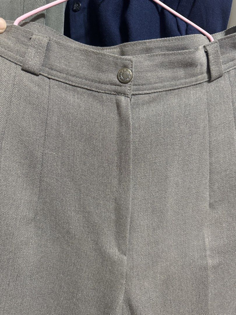 Grey Trousers with Button and Zip Closure (Category: Other Bottoms) located in Quezon City. Submitted by euniceescalada9 (Listing ID 1460126453, Image 1). Description: - Classic grey trousers - Button and zip closure - Belt loops for added style - Front pleats for a tailored fit - Subtle textured fabric - Versatile for work or casual occasions - Can fit 26 waistline , length is 35.