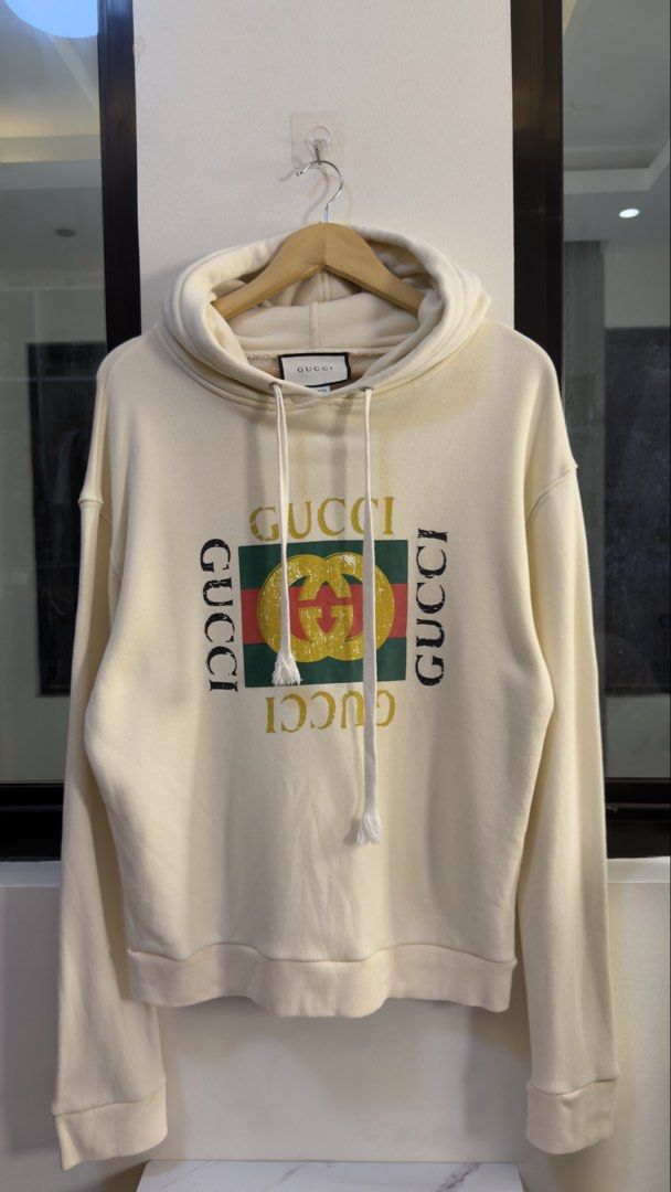 Gucci Cream Logo Hoodie (Category: Hoodies) located in Paranaque City. Submitted by mykapoynton (Listing ID 1460292652, Image 2). Description: Gucci Cream Logo Hoodie - Iconic GG logo on the front - Front pocket and drawstring hood - Made in Italy - Estimated size: Medium (M) - Ideal for any Gucci fan.